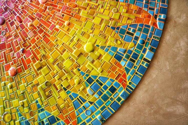 A multicoloured mosaic sun